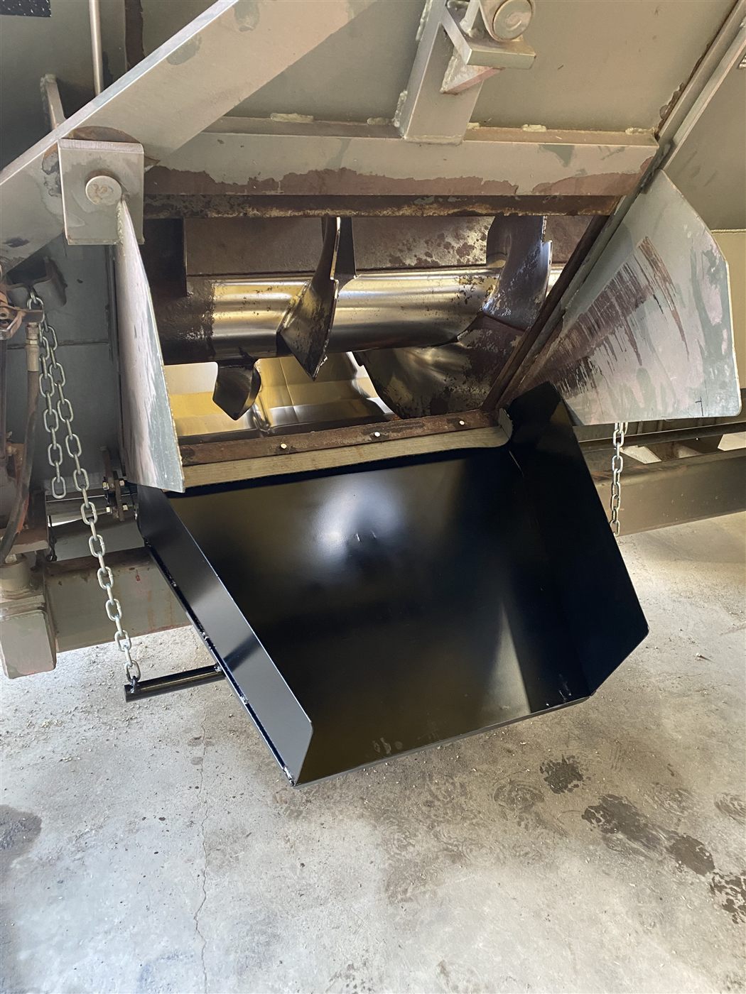 Finished custom steel grain chute installed on equipment