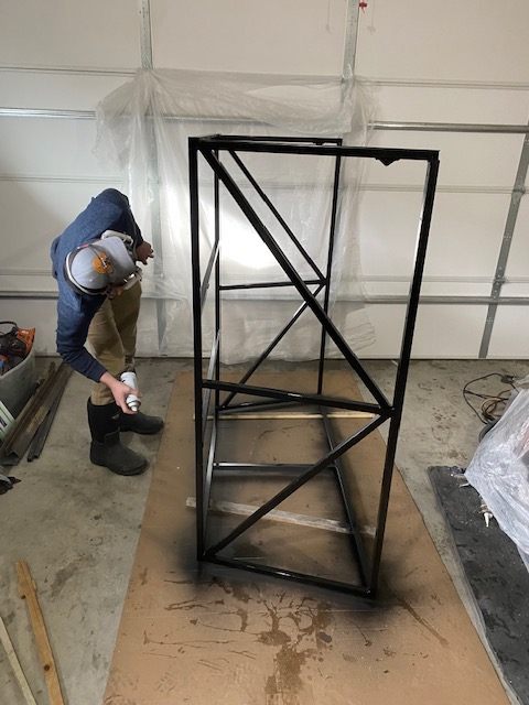 Welded steel frame being finished