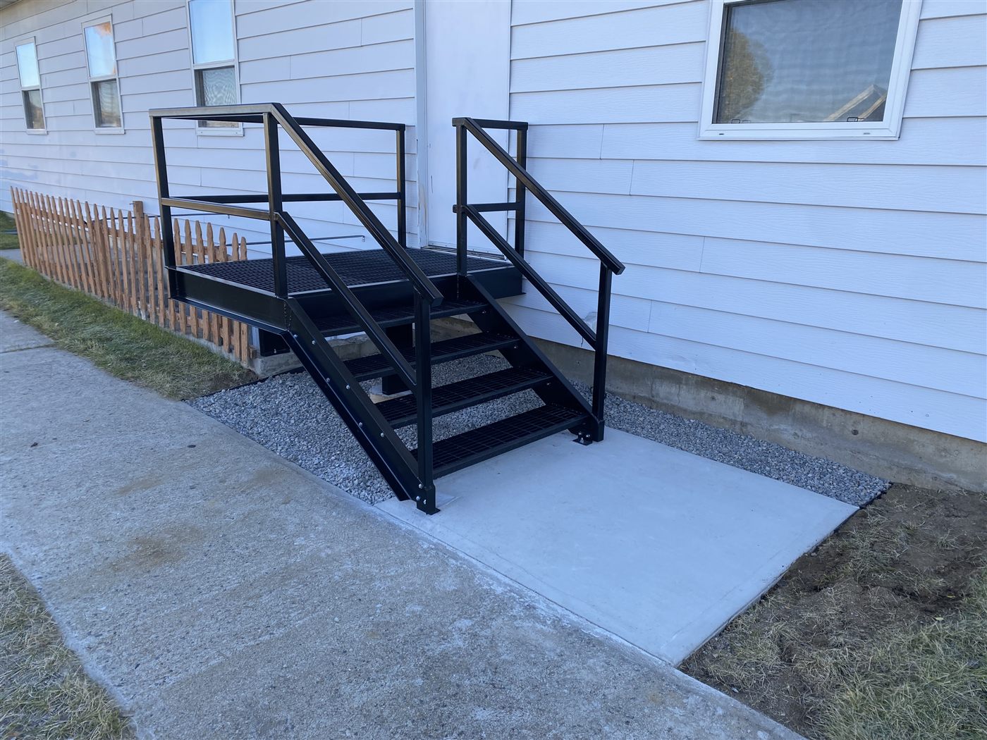 Finished steel entry steps and handrail installed at a church sanctuary